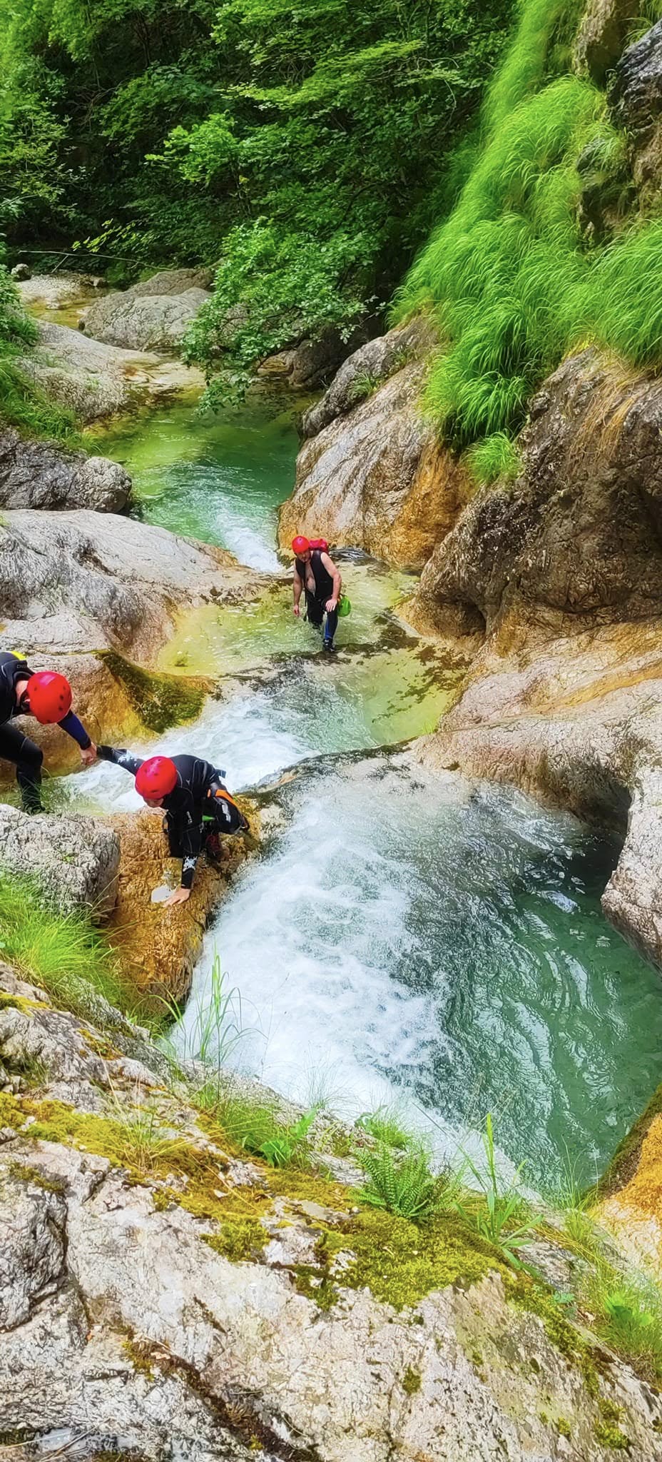 Climbing down beside a waterfall