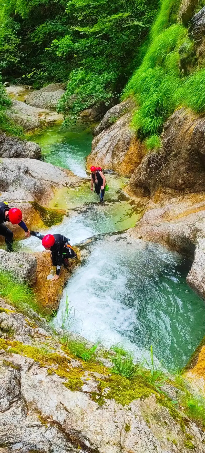 Climbing down beside a waterfall